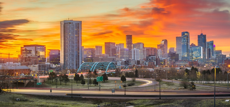 Denver, Colorado, USA downtown city skyline at dawn.